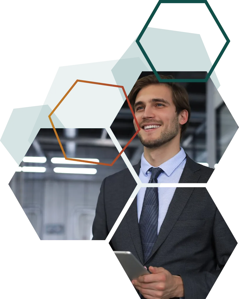 Smiling business professional in a suit holding a tablet, overlaid with hexagonal design elements. The image represents a modern, confident approach to business, reflecting the role of a trusted technology consulting & staffing partner.
